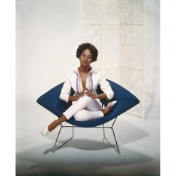 Jonathan Adler UK "Young Woman Sitting On Armchair" From Getty Images